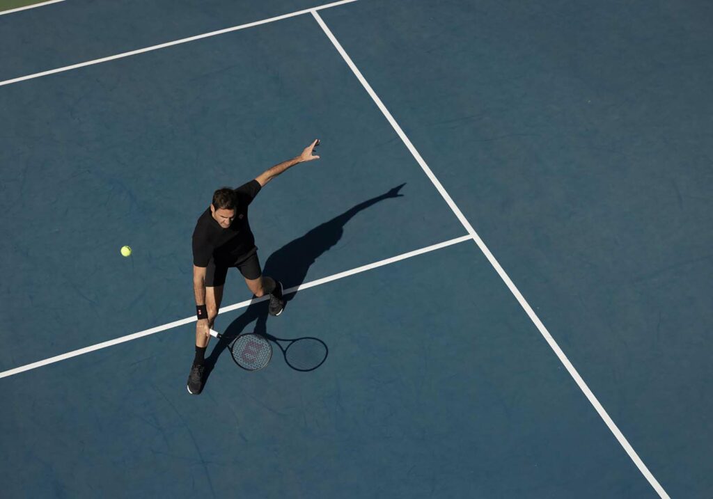 Roger Federer on court with RF Collection racket.