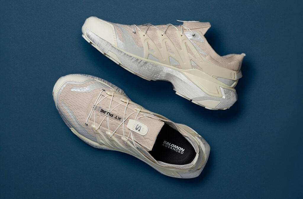 Top-down view of Salomon XT_PU.RE shoes in a beige and off-white color.